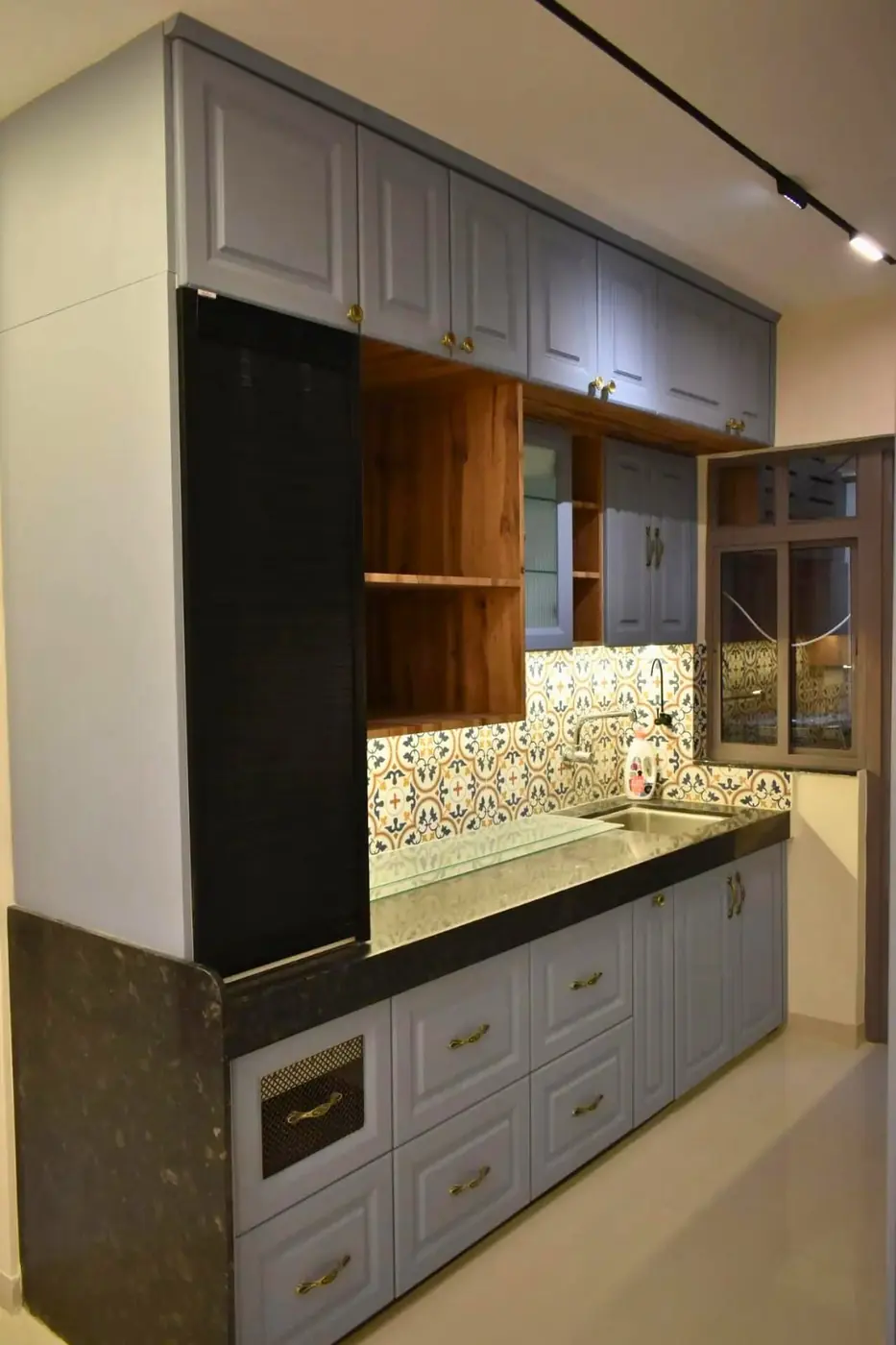 Grey shaker modular kitchen with wooden open shelves and patterned tile backsplash, Pune